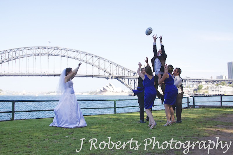 Bridal party rugby line out at Blues Point - wedding photography sydney
